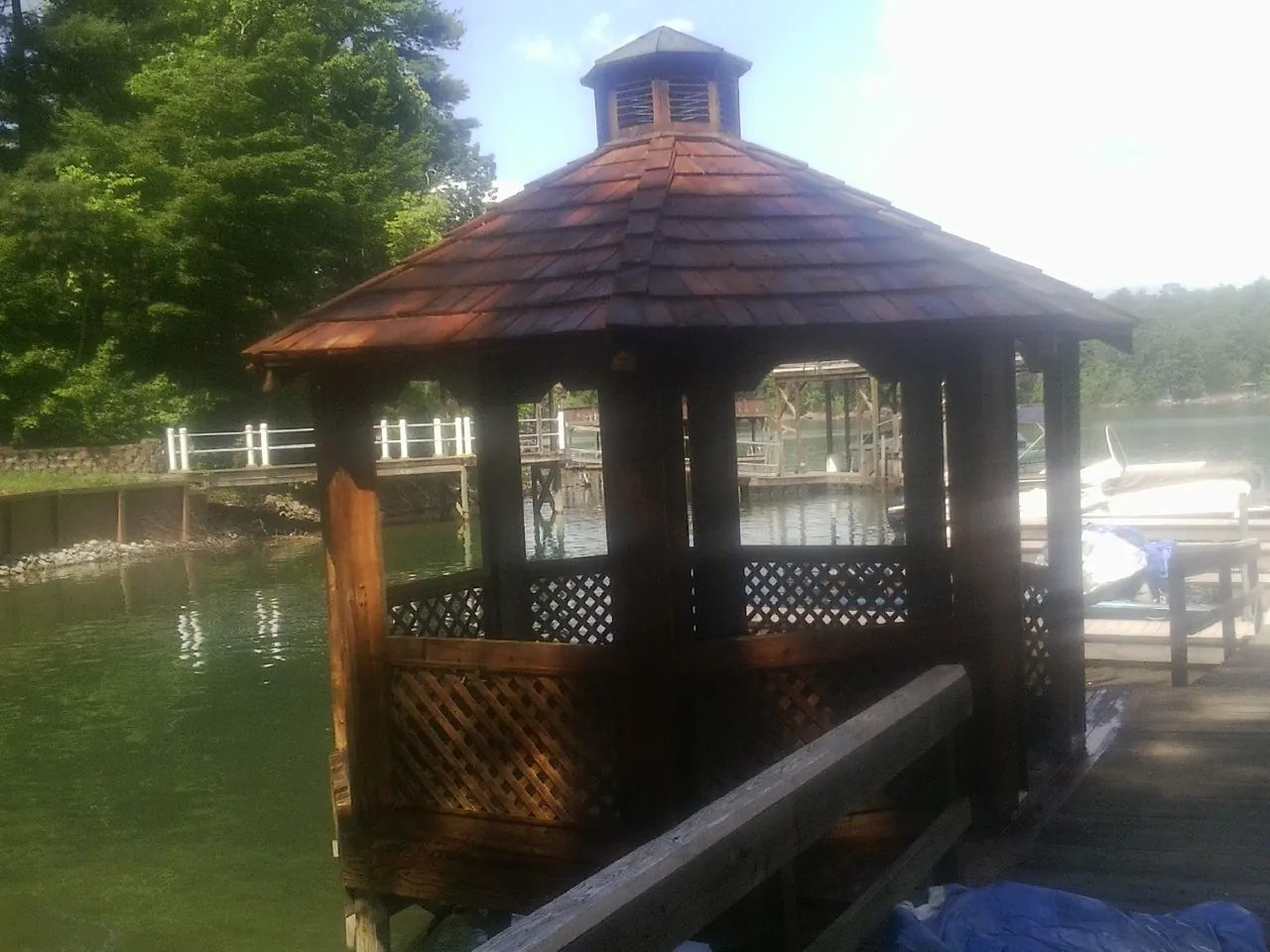 Cedar shake gazebo roof rebuilt on a lake dock in South Bloomingville